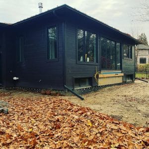 Home renovation vs rebuild Innisfil, modern house with construction plans